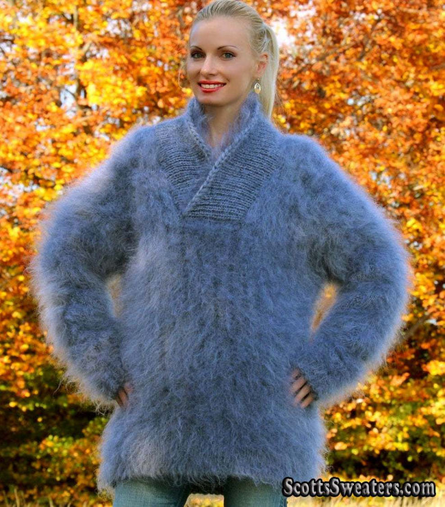 Unisex hand-knit mohair sweater with cross-over neck in soft blue color worn outdoors in autumn setting