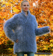 Unisex hand-knit mohair sweater with cross-over neck in soft blue worn outdoors in autumn