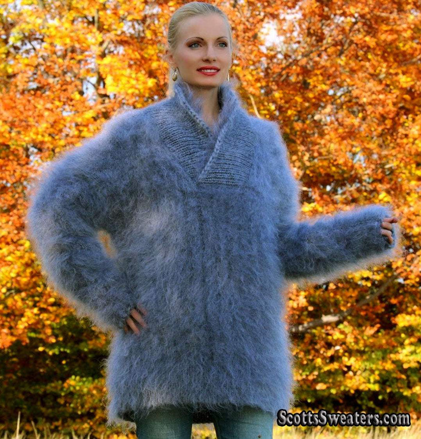 Unisex hand-knit mohair sweater with cross-over neck in soft blue worn outdoors in autumn