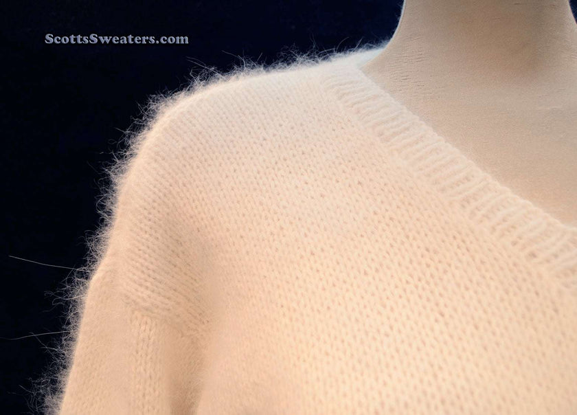 Woman's white hand-knit angora V-neck sweater by Scott's Sweaters, medium size, made from home-spun angora yarn