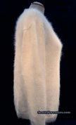 Woman wearing white hand-knit angora V-neck sweater by Scott's Sweaters, medium size.