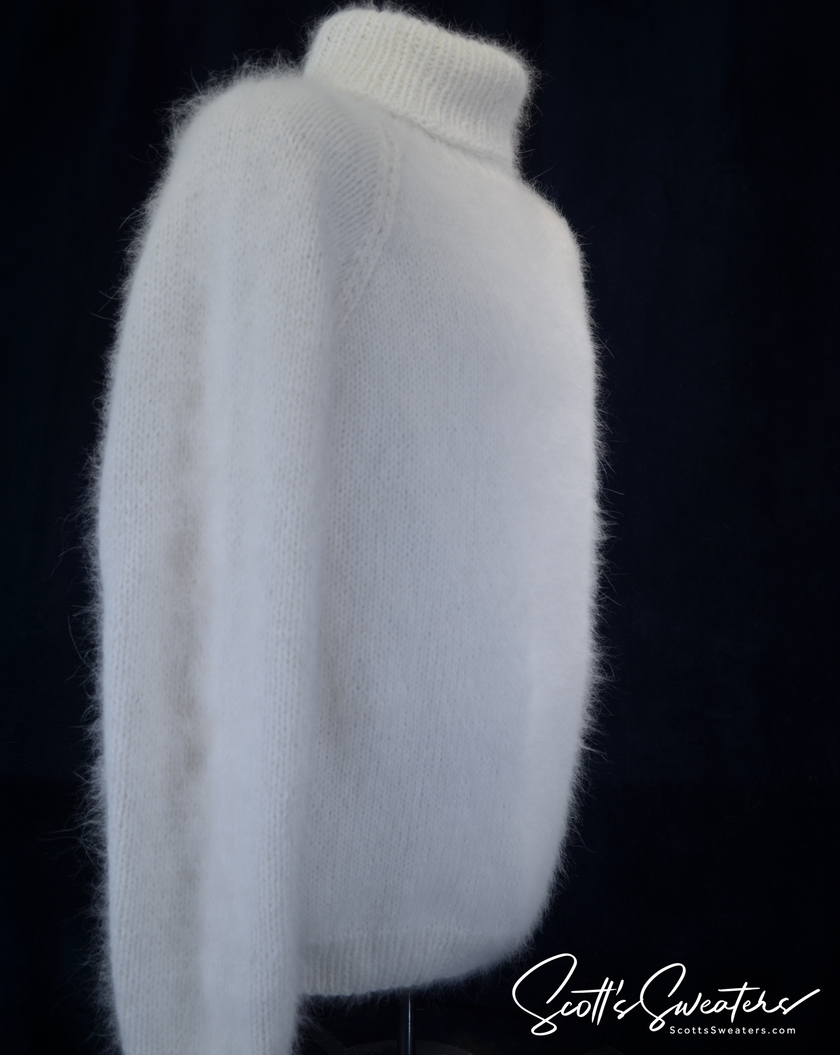 Men's handknit luxurious turtleneck angora sweater in cream color, made of 75% angora and 25% nylon.