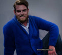 Man wearing a royal blue men's solid-color angora cardigan sweater with shawl-neck collar