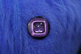 Woman wearing a powder-blue angora cardigan sweater with pockets by Connie A. Lee