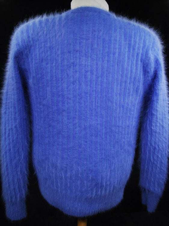 Woman's powder-blue angora cardigan sweater with pockets by Connie A. Lee