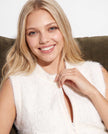 Woman's white angora zipper-front sweater vest with slash pockets and sleek fit