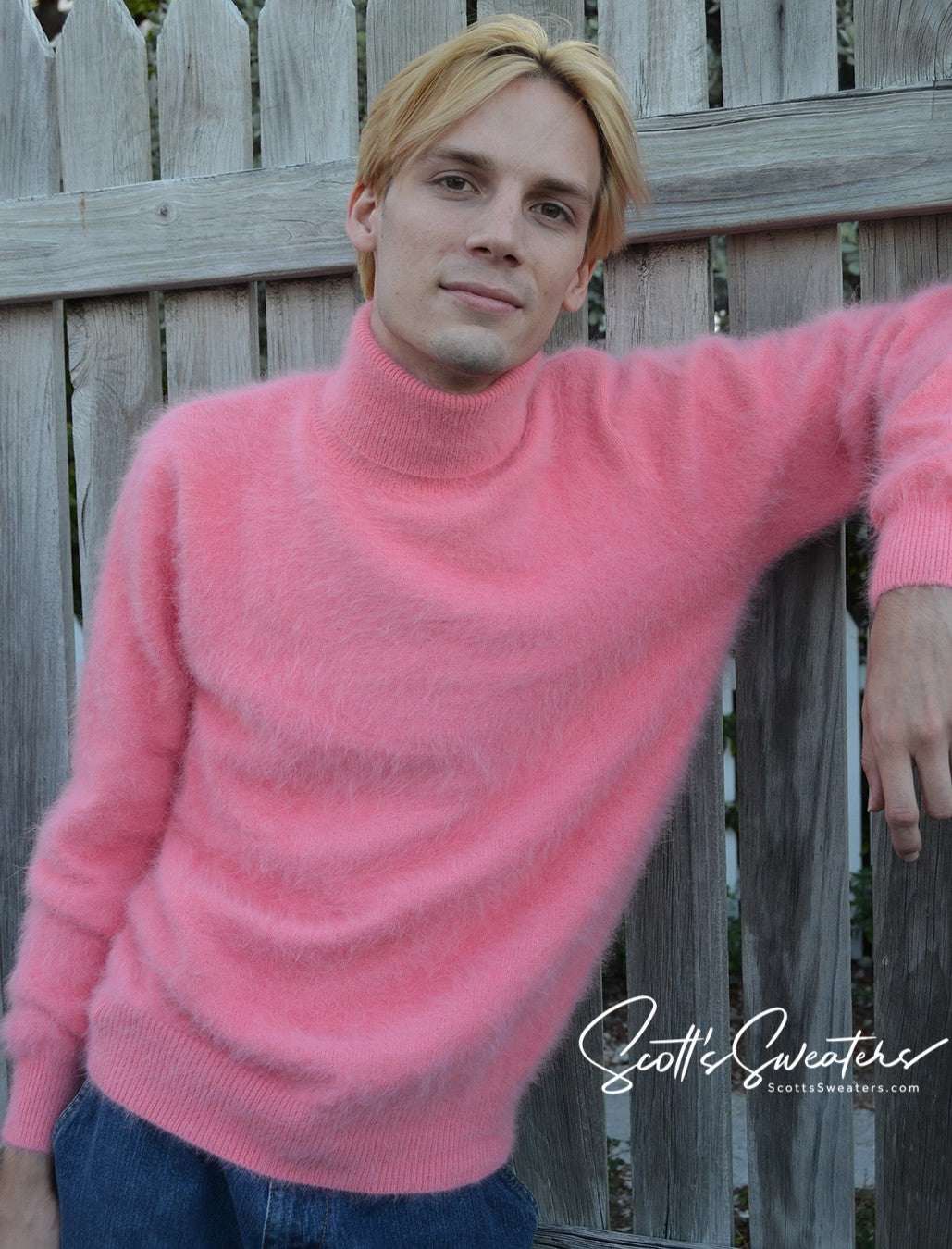 Man wearing pink ultra-soft angora men's turtleneck sweater outdoors