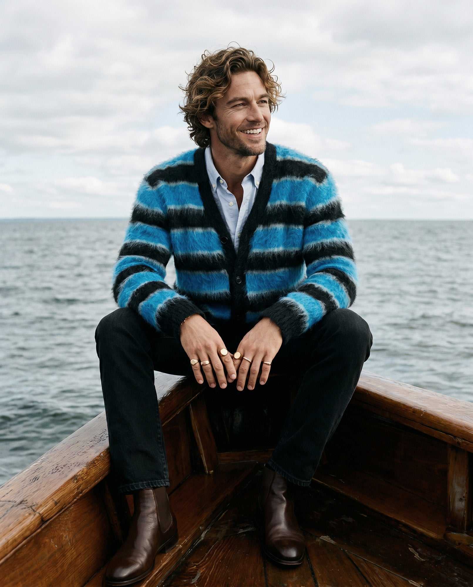Men's fuzzy cardigan with colorful stripes made from soft plush fabric for casual comfort and style